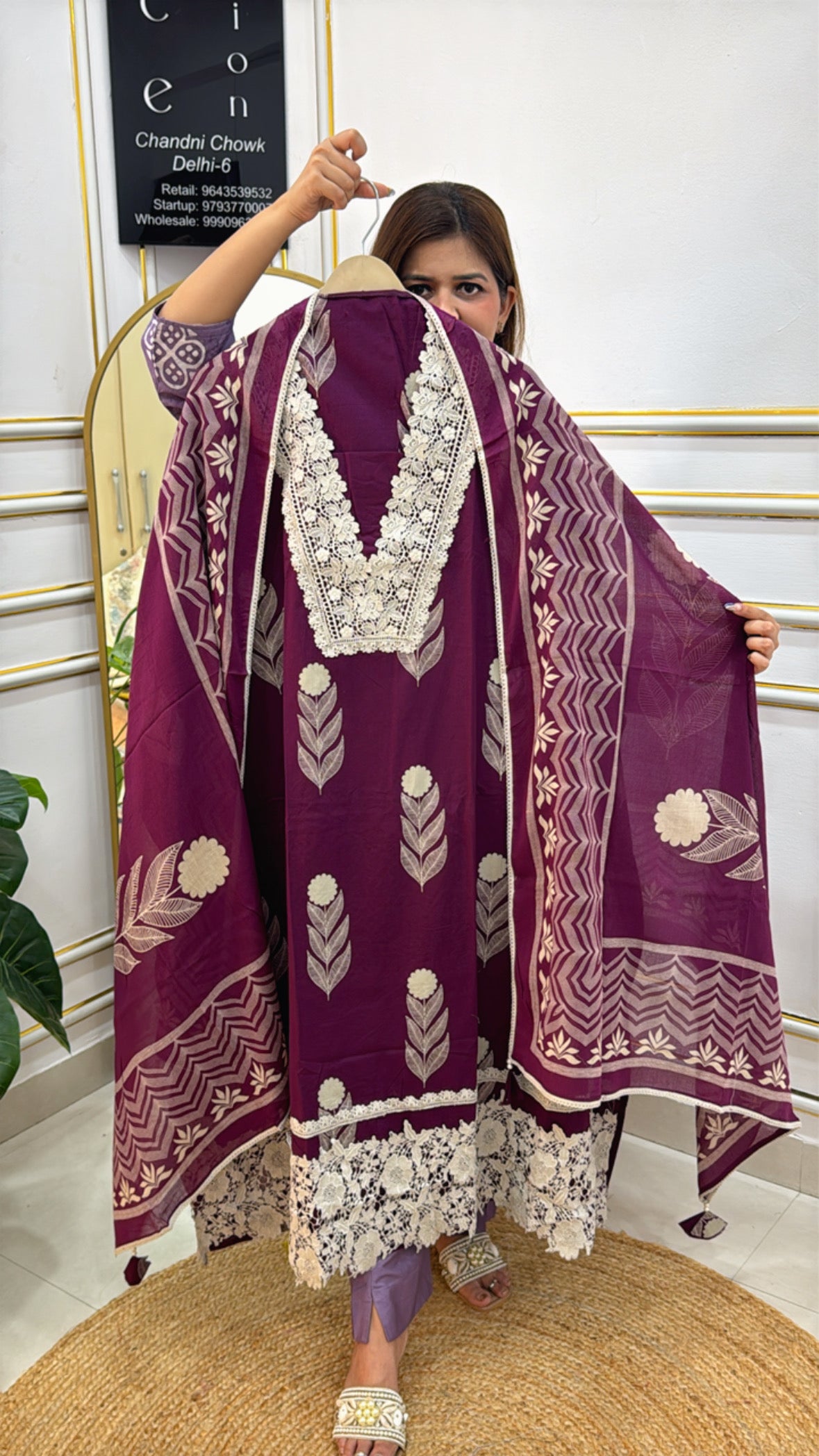 Model showcasing a premium embroidered dupatta set in purple with intricate floral patterns and lace detailing